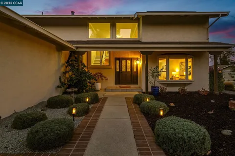 a view of an entryway with wooden floor and stairs