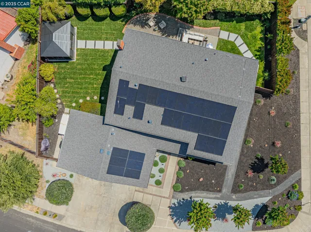 an aerial view of house with yard