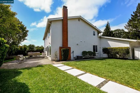 a view of a patio with a yard