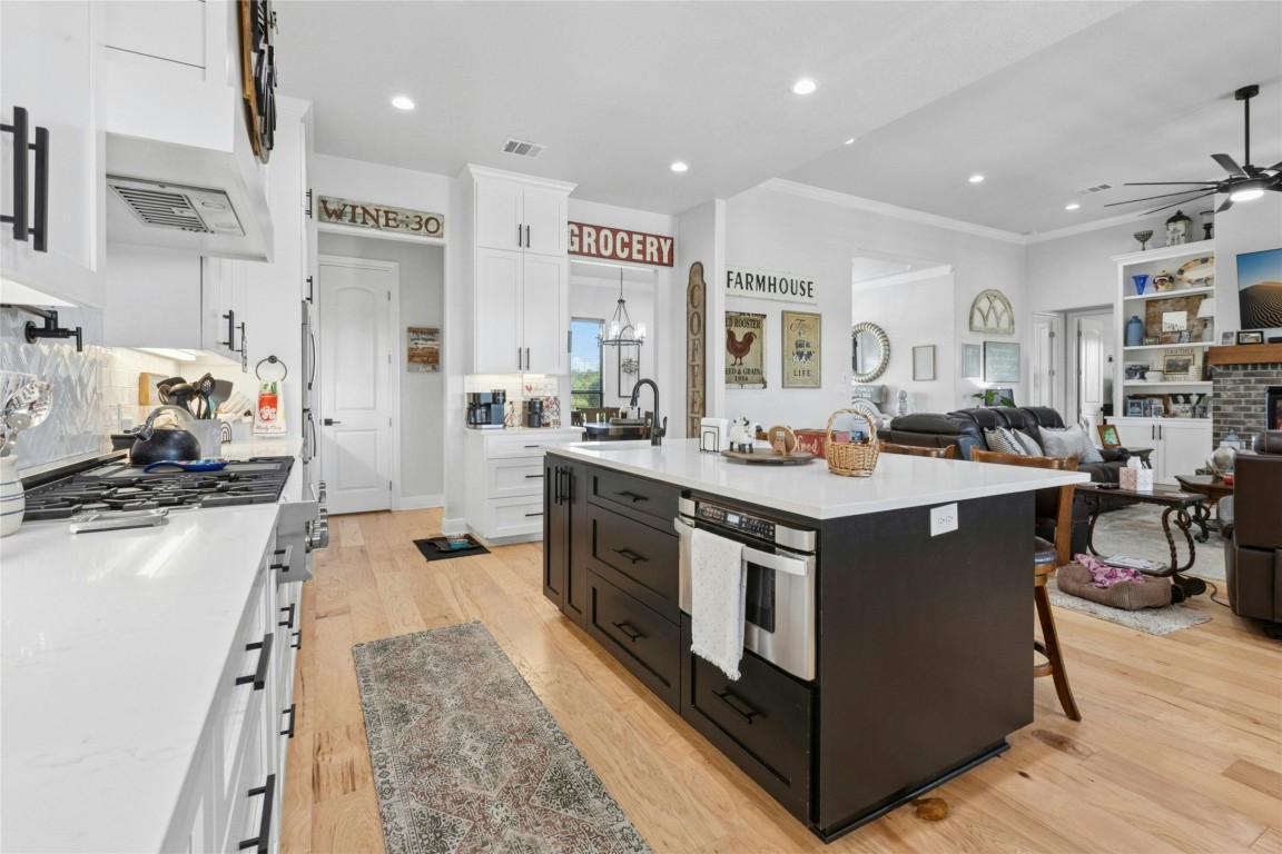 1170 Watterson Road Red Rock, TX 78662 - Photo 12 of 36 a kitchen with stainless steel appliances granite countertop a stove and a refrigerator