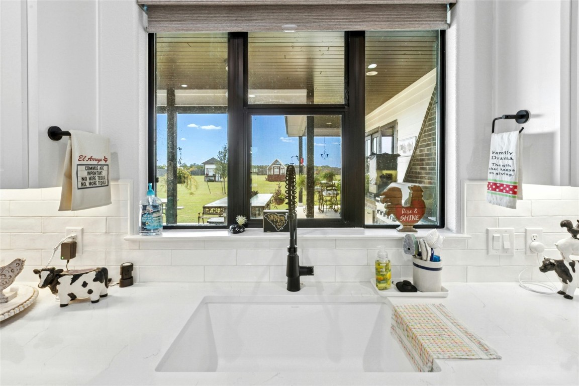 1170 Watterson Road Red Rock, TX 78662 - Photo 14 of 36 a bathroom with a tub sink and large window