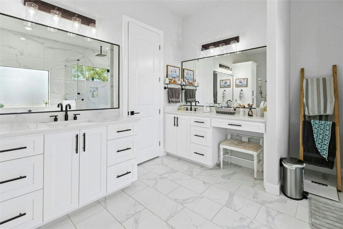1170 Watterson Road Red Rock, TX 78662 - Photo 18 of 36 a bathroom with a double vanity sink mirror and