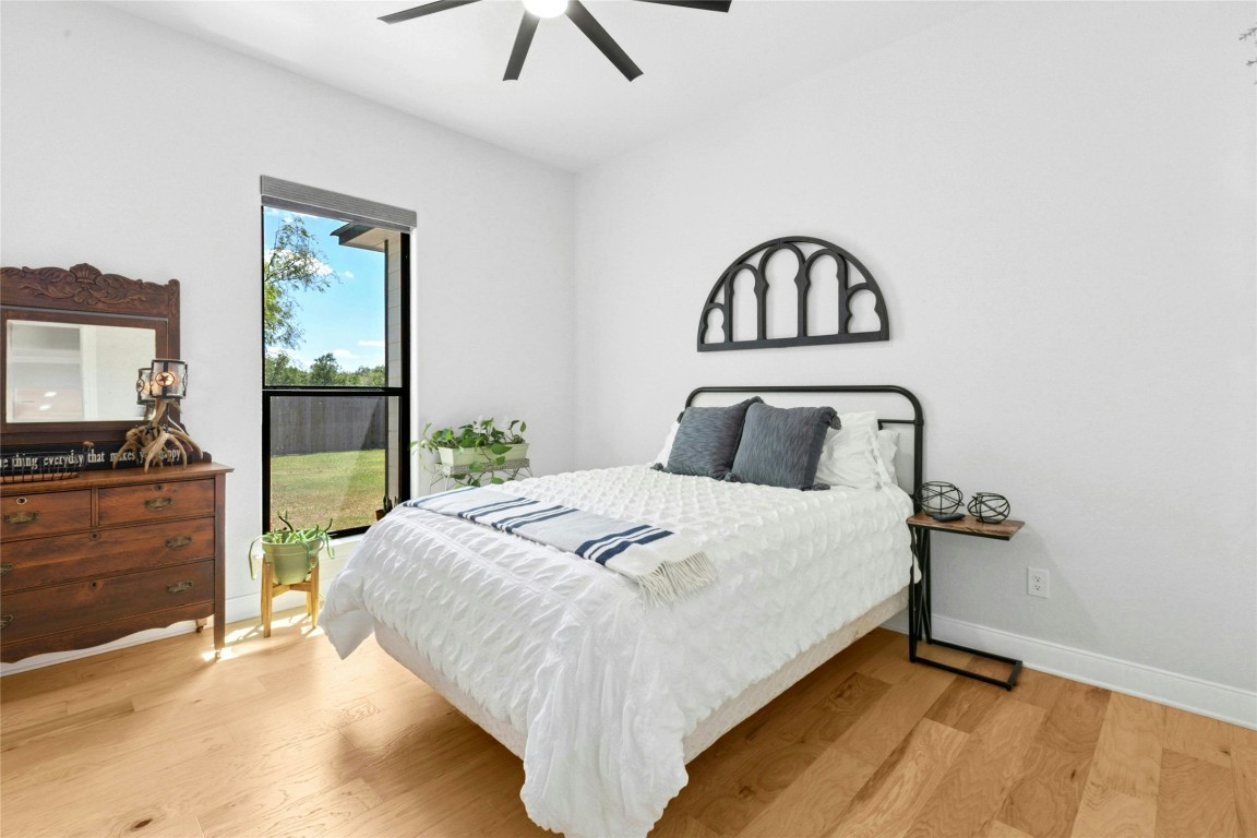 1170 Watterson Road Red Rock, TX 78662 - Photo 21 of 36 a bedroom with a bed and a dresser