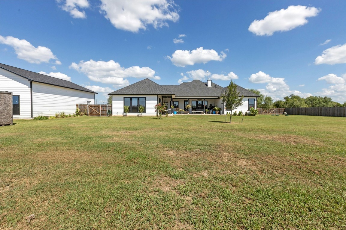 1170 Watterson Road Red Rock, TX 78662 - Photo 32 of 36 a view of a house with a yard