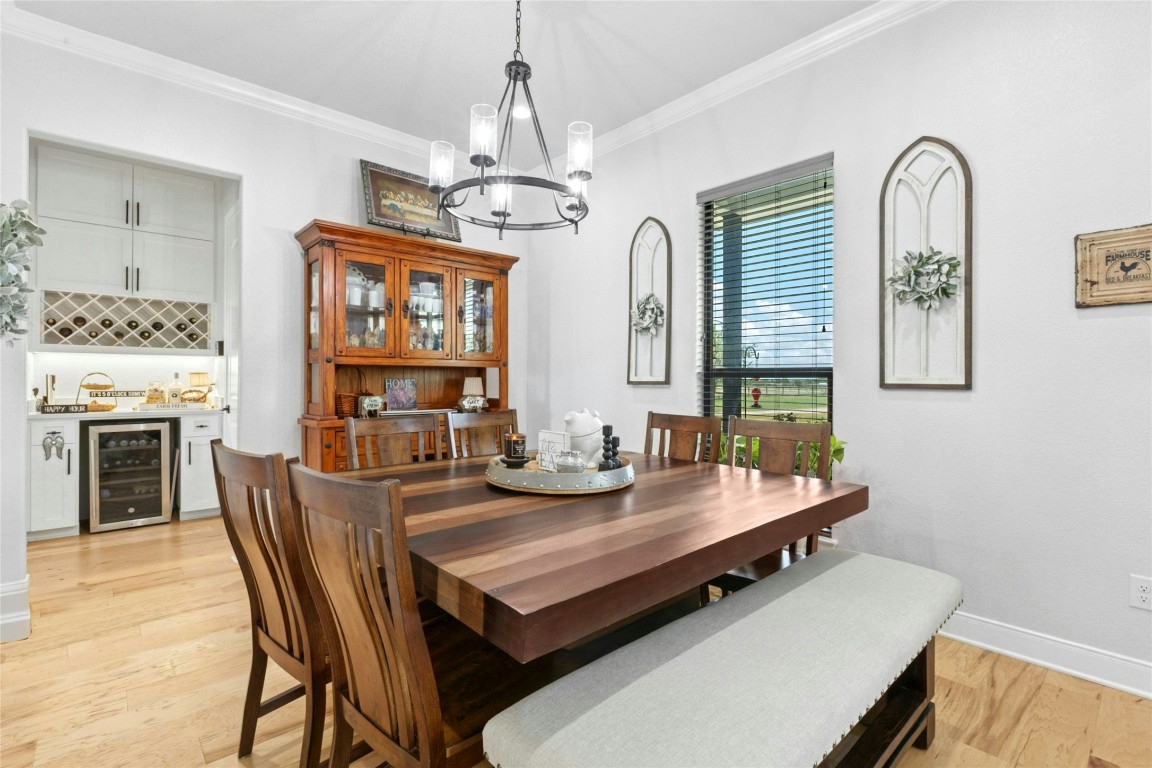 1170 Watterson Road Red Rock, TX 78662 - Photo 10 of 36 a view of a dining room with furniture and a chandelier