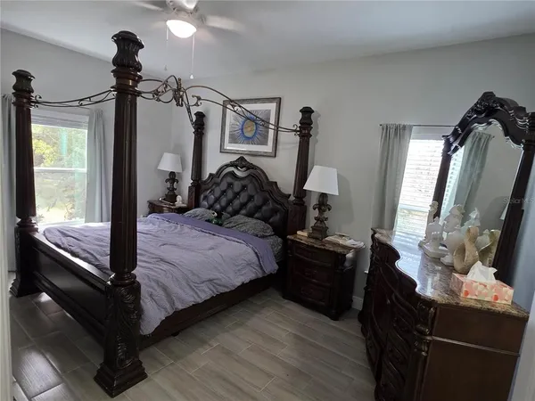 a bedroom with a bed and a window