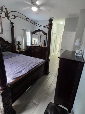 a bedroom with a bed and a dresser