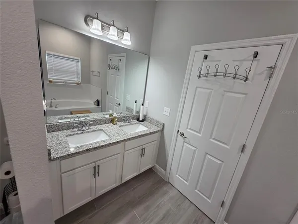 a bathroom with a tub and a shower