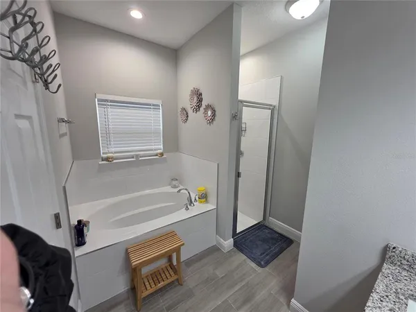 a bathroom with a glass door shower