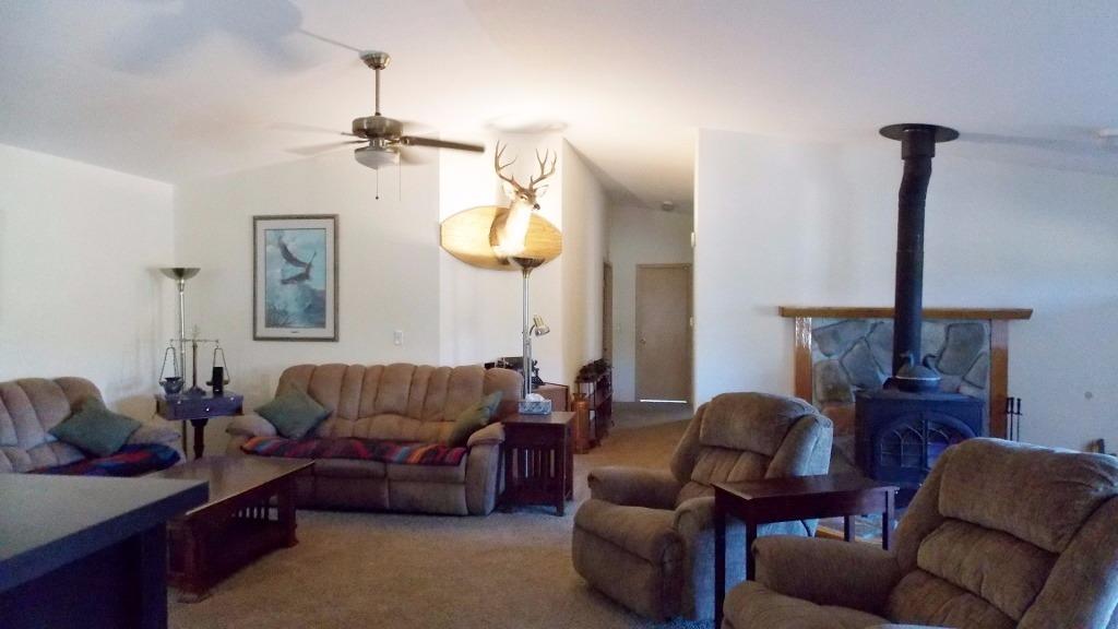 1894 South Obenchain Road Eagle Point, OR 97524 - Photo 5 of 16 a living room with furniture a couch and chandelier