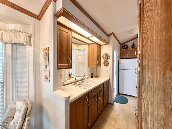 a bathroom with a double vanity sink a mirror and a bathtub