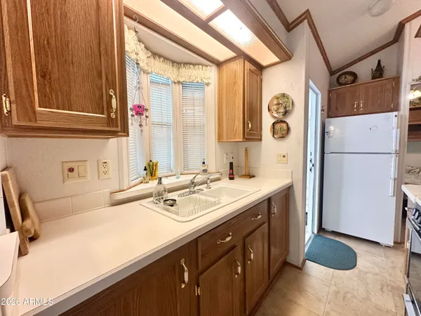 a kitchen with a sink and a refrigerator