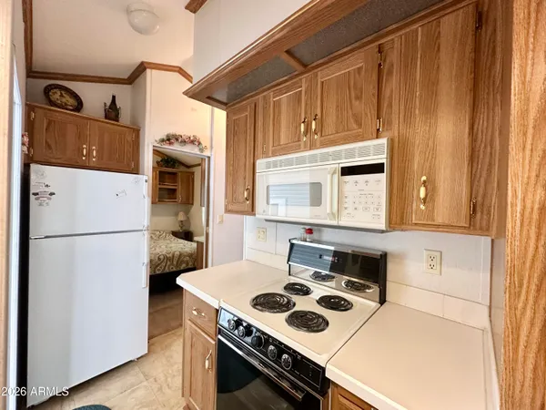 a kitchen with a stove and a refrigerator