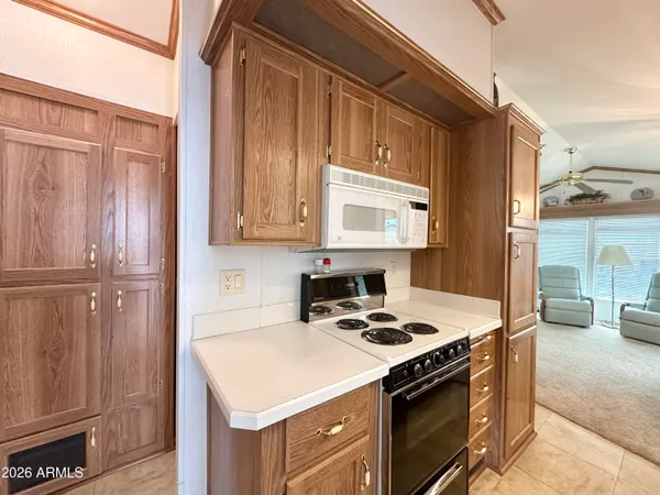 a kitchen with a stove and a refrigerator