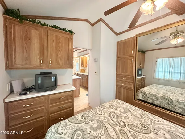 a bedroom with a bed and a dresser