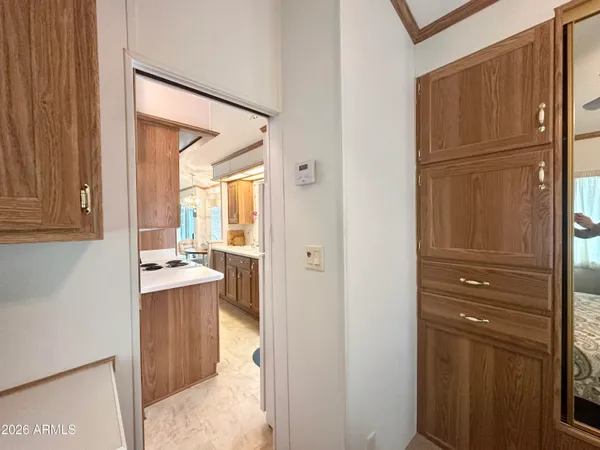 a kitchen with a refrigerator and cabinets