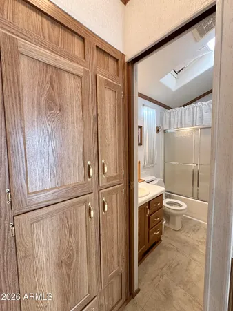 a bathroom with a double vanity sink and mirror