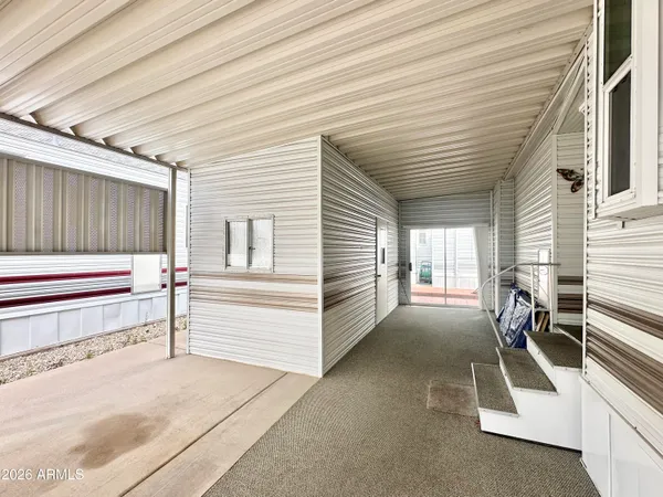 a view of a porch with furniture
