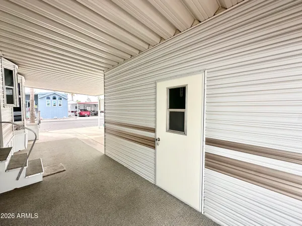 a view of a porch with seating space