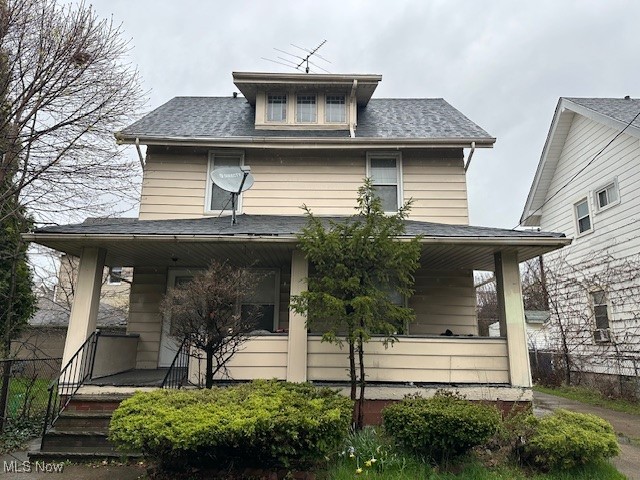 831 London Road Cleveland, OH 44110 - Photo 1 of 11 American foursquare style home with a porch and roof with shingles