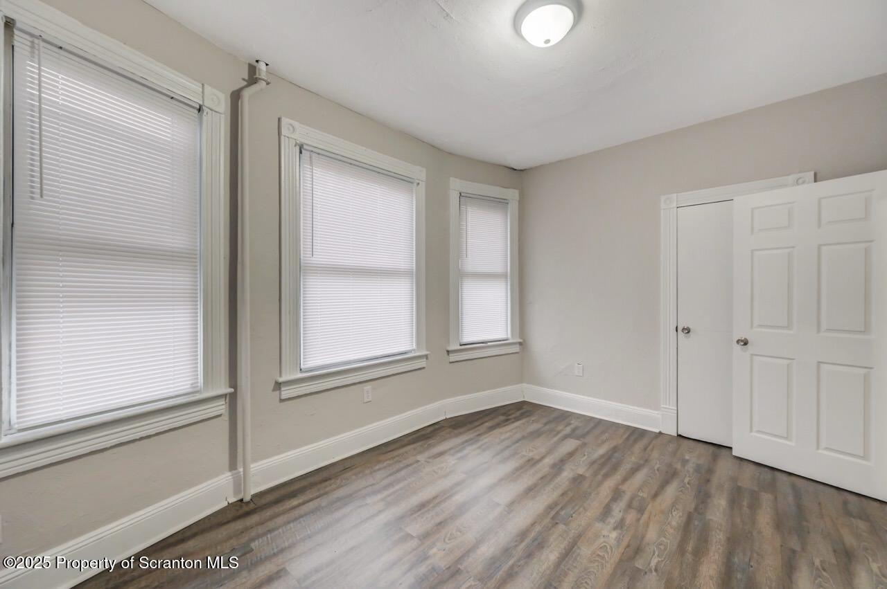 516 Harrison Avenue Scranton, PA 18510 - Photo 12 of 74 a view of empty room with wooden floor and fan