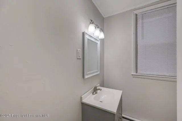 front view of house with large trees