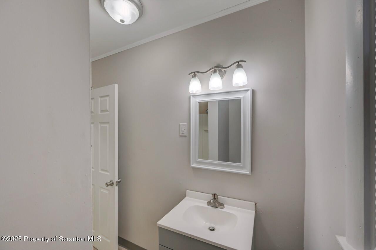 516 Harrison Avenue Scranton, PA 18510 - Photo 16 of 74 a bathroom with a sink and a mirror