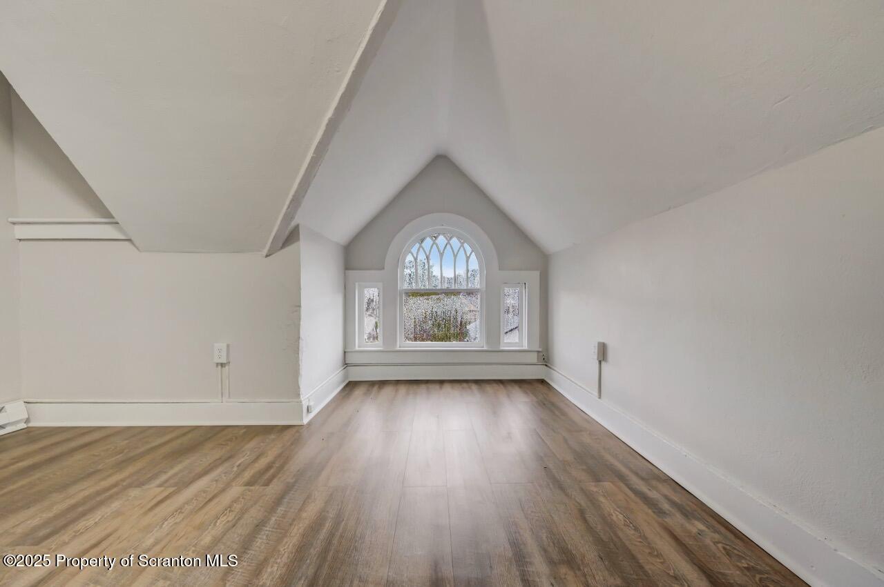 516 Harrison Avenue Scranton, PA 18510 - Photo 25 of 74 an empty room with wooden floor and window