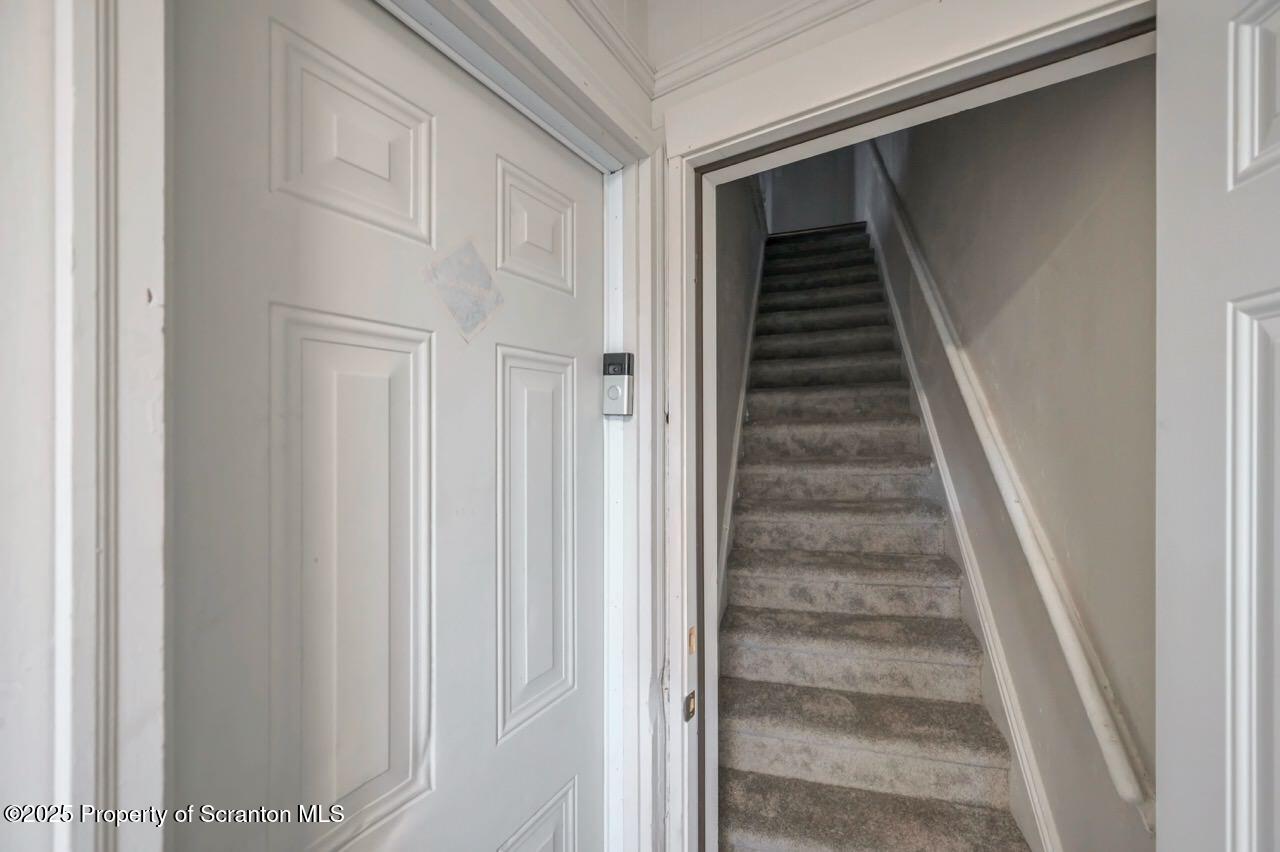 516 Harrison Avenue Scranton, PA 18510 - Photo 3 of 74 a view of staircase with white walls and white door