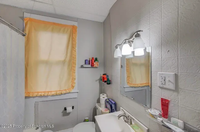 a bathroom with a sink and a washing machine