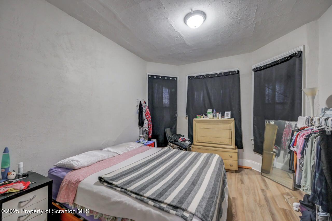 516 Harrison Avenue Scranton, PA 18510 - Photo 37 of 74 a bed room with a bed and a closet