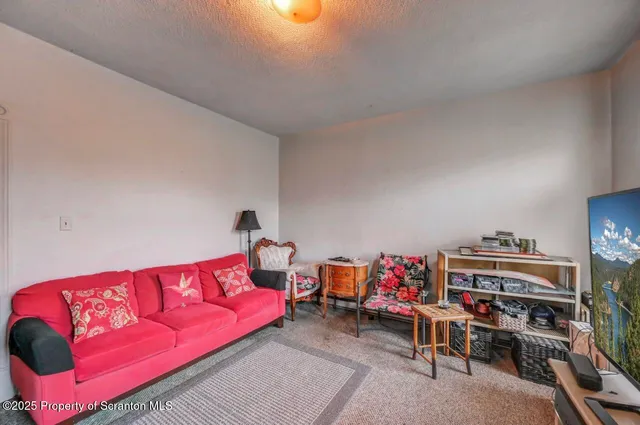 a room with furniture and a flat screen tv