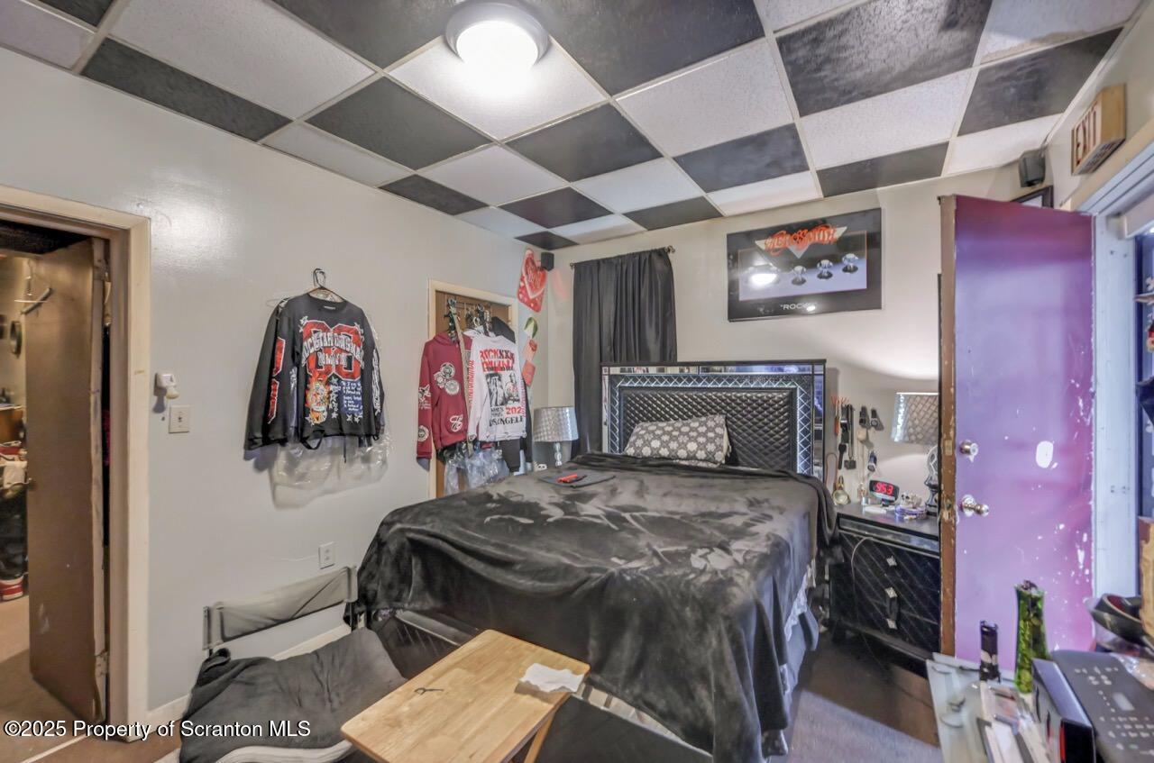 516 Harrison Avenue Scranton, PA 18510 - Photo 66 of 74 a bedroom with a bed and a flat screen tv
