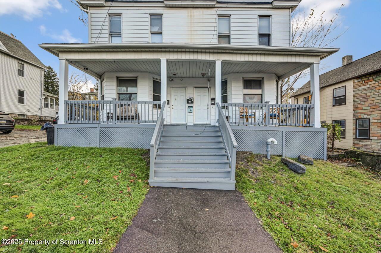 516 Harrison Avenue Scranton, PA 18510 - Photo 68 of 74 a front view of a house with garden and sitting area