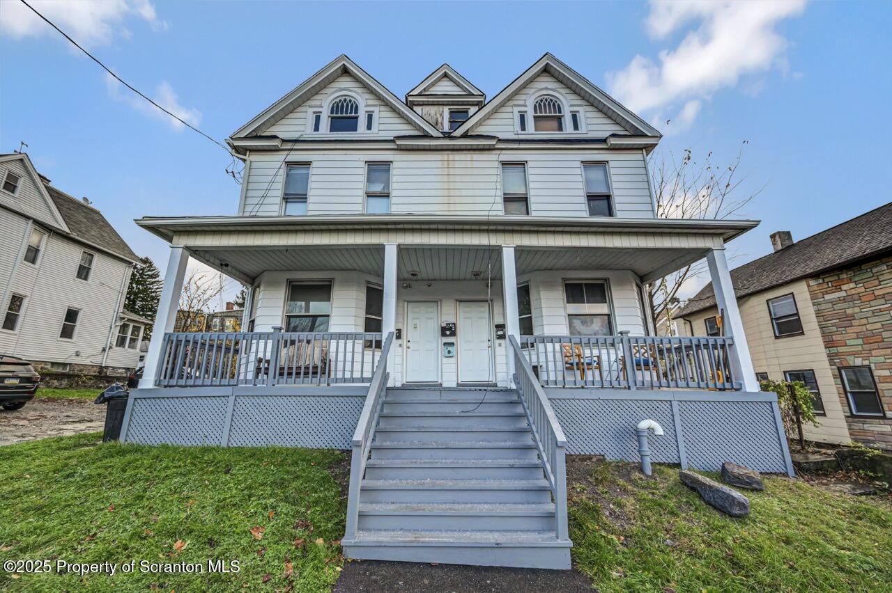 516 Harrison Avenue Scranton, PA 18510 - Photo 69 of 74 a front view of a house with yard and parking