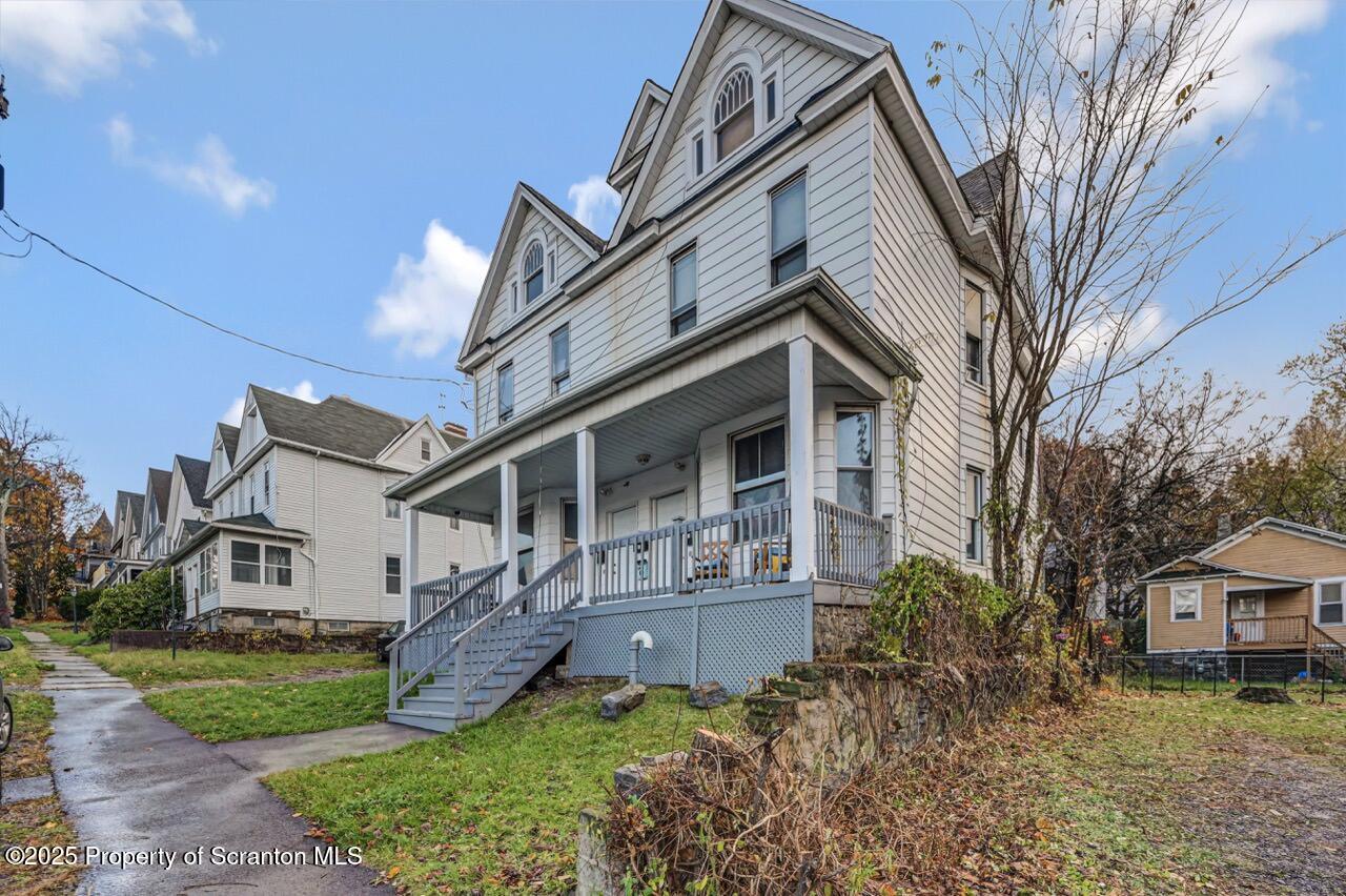 516 Harrison Avenue Scranton, PA 18510 - Photo 73 of 74 a view of a house with a big yard and large tree