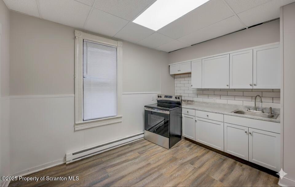 516 Harrison Avenue Scranton, PA 18510 - Photo 9 of 74 a kitchen with granite countertop a sink cabinets and wooden floor