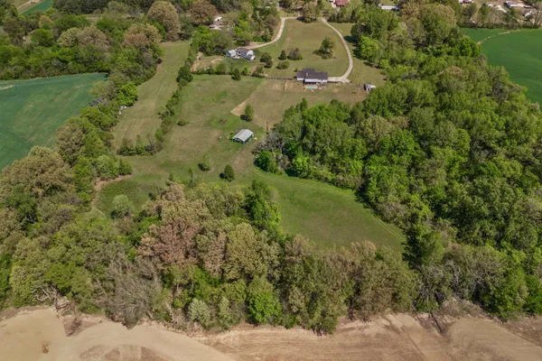 a aerial view of a houses with a yard