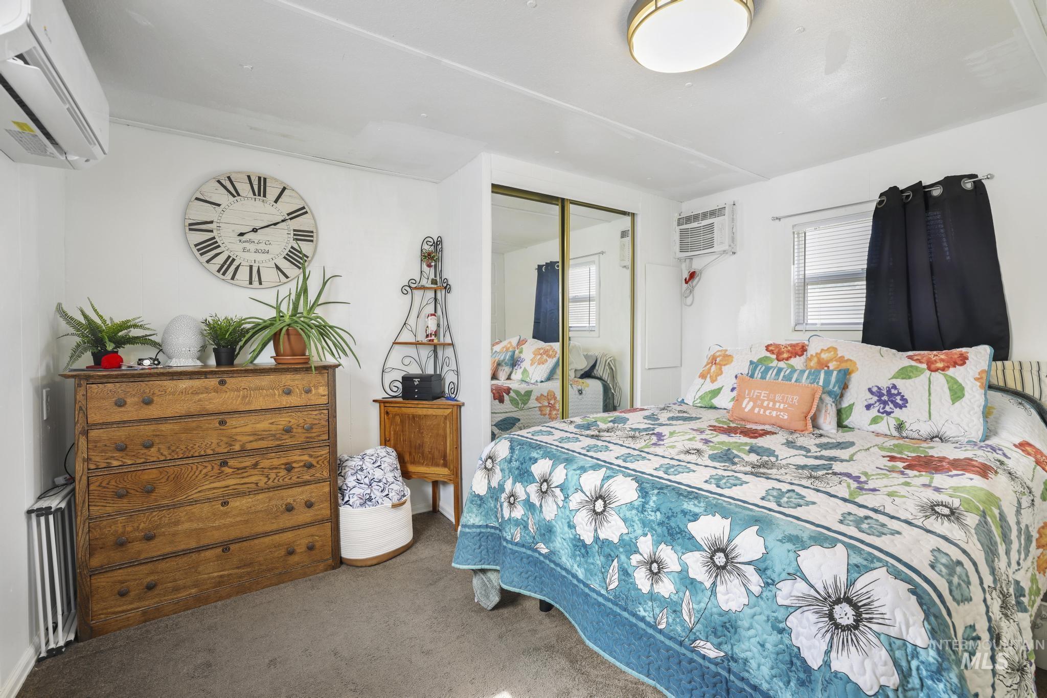198 South Hills Road, Unit 45 Twin Falls, ID 83301 - Photo 17 of 25 Carpeted bedroom featuring a mini split for heating / cooling and a closet
