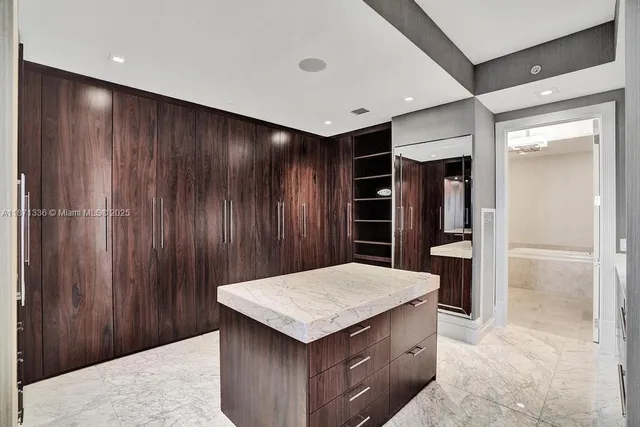a kitchen with a refrigerator and countertop
