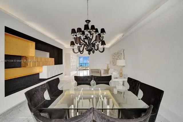 a kitchen with kitchen island a stove and a refrigerator
