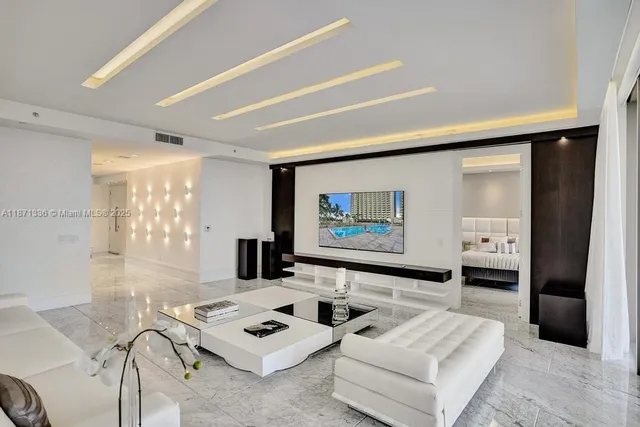 a bedroom with a bed and large windows