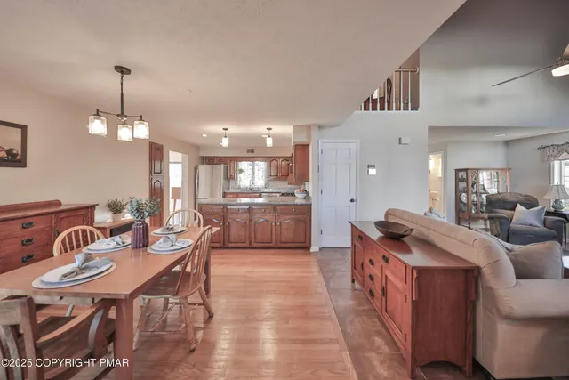 a bed sitting in a spacious bedroom next to a window
