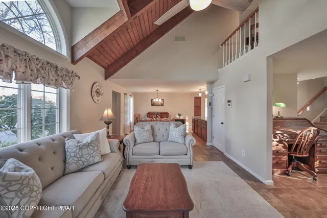 a kitchen with stainless steel appliances granite countertop wooden cabinets sink and stove