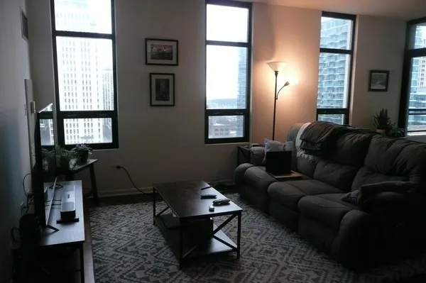 a living room with furniture and a window