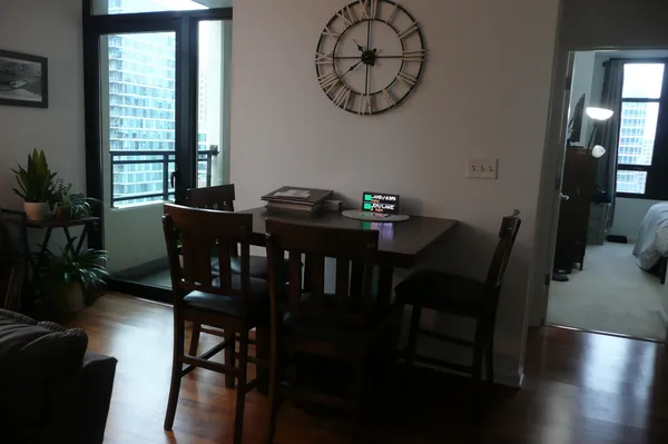 a view of a dining room with furniture window and wooden floor