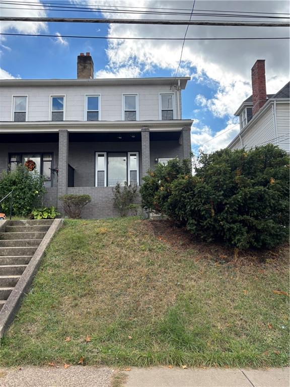 1216 Vance Avenue Coraopolis, PA 15108 - Photo 1 of 19 a view of a house with brick walls and potted plants