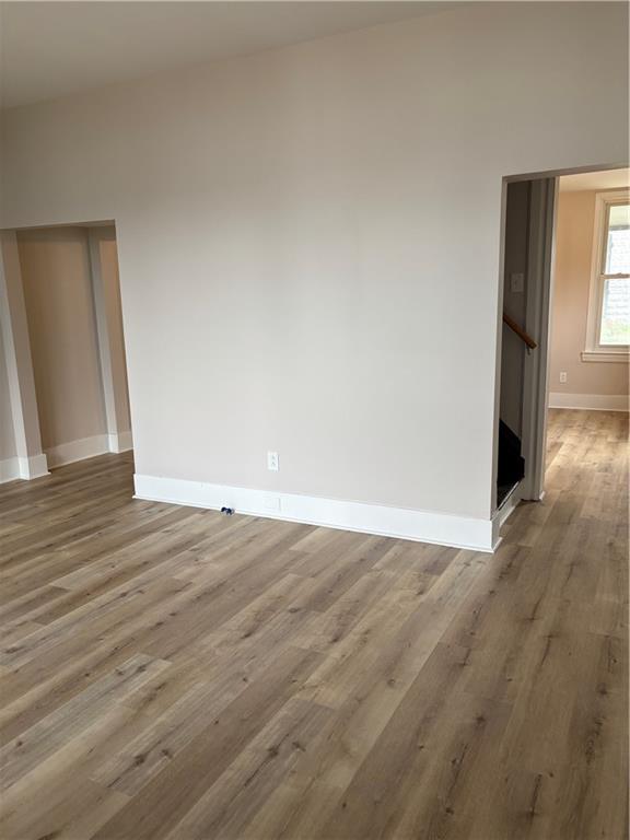 1216 Vance Avenue Coraopolis, PA 15108 - Photo 3 of 19 a view of an empty room with wooden floor and a window