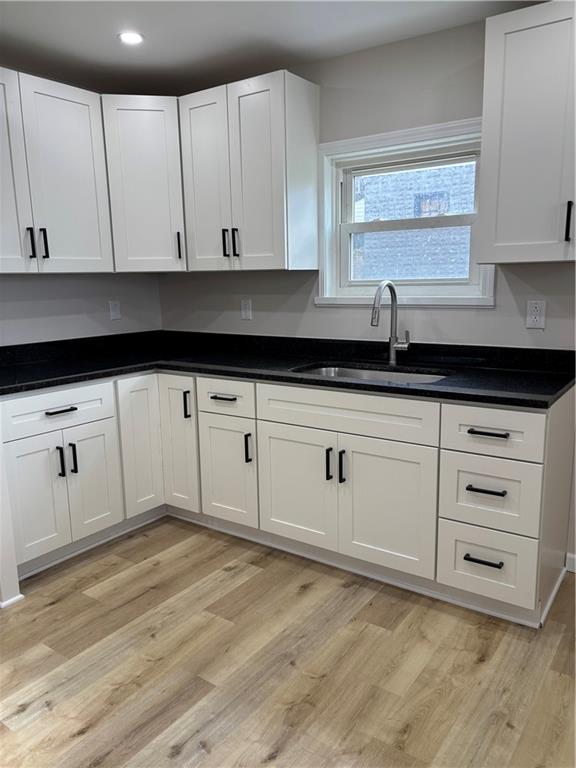 1216 Vance Avenue Coraopolis, PA 15108 - Photo 5 of 19 a kitchen with granite countertop white cabinets and sink