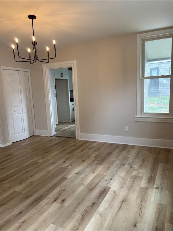1216 Vance Avenue Coraopolis, PA 15108 - Photo 9 of 19 a view of an empty room with window and wooden floor